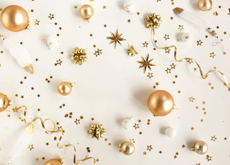 Fototapeta premium Christmas background . Xmas or new year white gold color decorations on white background with empty copy space for text. holiday and celebration concept for postcard or invitation. top view 