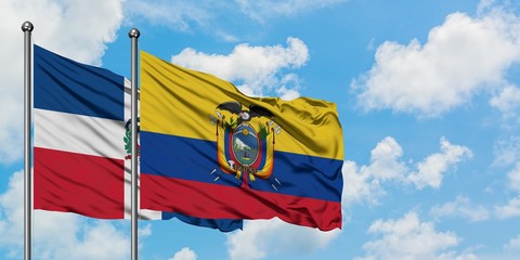 Dominican Republic and Ecuador flag waving in the wind against white cloudy blue sky together. Diplomacy concept, international relations.
