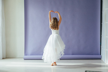 Beautiful girl of 10 years dancing in a white dress © dmitriisimakov