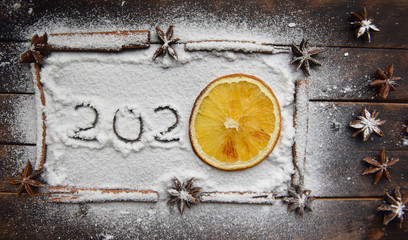 Christmas still life of dried oranges, cinnamon, star anise powdered sugar