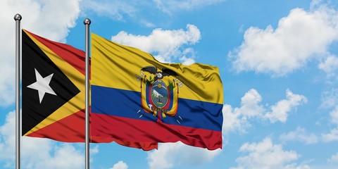 East Timor and Ecuador flag waving in the wind against white cloudy blue sky together. Diplomacy concept, international relations.