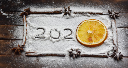 Christmas still life of dried oranges, cinnamon, star anise powdered sugar