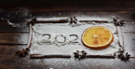 Christmas still life of dried oranges, cinnamon, star anise powdered sugar