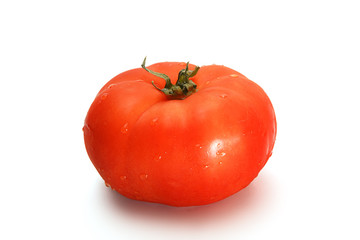 Delicious red tomato on a white background.