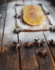 Christmas still life of dried oranges, cinnamon, star anise powdered sugar