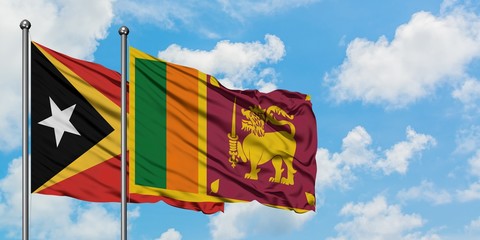East Timor and Sri Lanka flag waving in the wind against white cloudy blue sky together. Diplomacy concept, international relations.