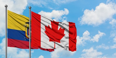 Ecuador and Canada flag waving in the wind against white cloudy blue sky together. Diplomacy concept, international relations.