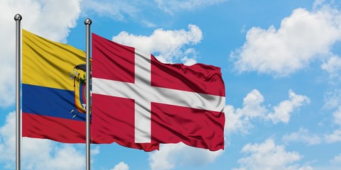 Ecuador and Denmark flag waving in the wind against white cloudy blue sky together. Diplomacy concept, international relations.