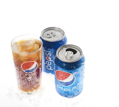 POLTAVA, UKRAINE - MARCH 22, 2018: cold pepsi and a glass on a white background.Pepsi is carbonated soft drink produced by PepsiCo. Pepsi was created and developed in 1893