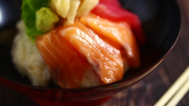 Japanese food: Mix sashimi and ebi served with Japanese cooked rice on table. Clean food concept. Focus shift and movement camera. Selective focus and free space for text.