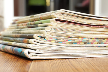 Newspapers and Magazines. Stack of News Pages with Headlines and Articles. Tabloid Journals Folded...