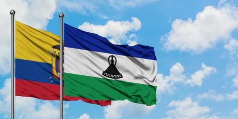 Ecuador and Lesotho flag waving in the wind against white cloudy blue sky together. Diplomacy concept, international relations.