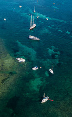 Aerial drone shot view of yachts in mediterranean sea in summer time near Nice, south France
