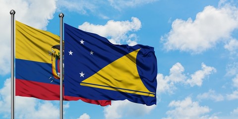 Ecuador and Tokelau flag waving in the wind against white cloudy blue sky together. Diplomacy...