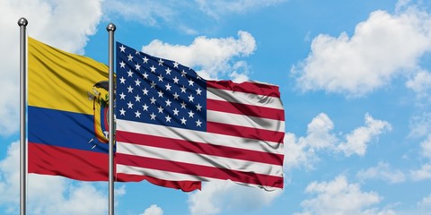 Ecuador and United States flag waving in the wind against white cloudy blue sky together. Diplomacy concept, international relations.