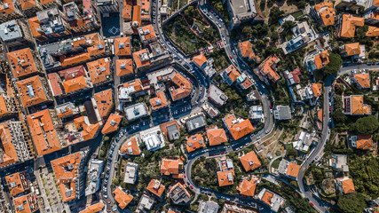 Overhead aerial view of red orange houses and trees in La Spezia in Italy