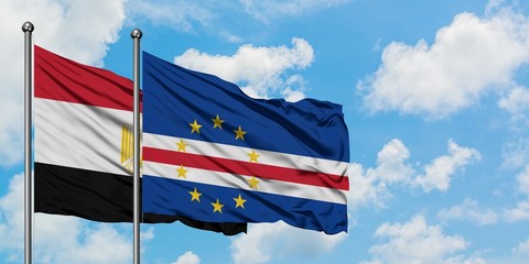 Egypt and Cape Verde flag waving in the wind against white cloudy blue sky together. Diplomacy concept, international relations.