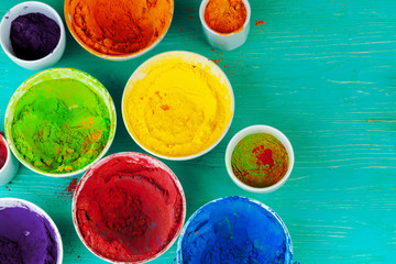 Bows of colorful Holi power close up on floor