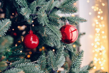 Christmas tree decorations red balls and star, with bokeh light