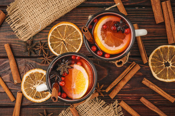 Christmas composition with  hot mulled wine in rustic cup