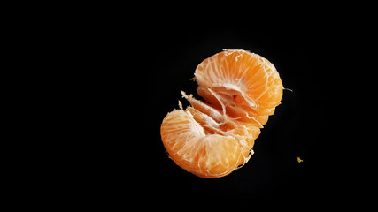 Orange fruit isolated on a black background with more freshness