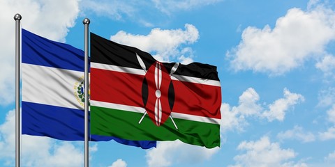 El Salvador and Kenya flag waving in the wind against white cloudy blue sky together. Diplomacy concept, international relations.