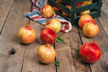 Pile of ripe  pomegranate on wooden backgfround