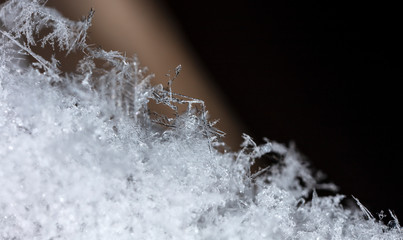 photo real snowflakes during a snowfall, under natural conditions at low temperature