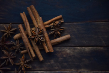 Cassia sticks and star anise on a brown background