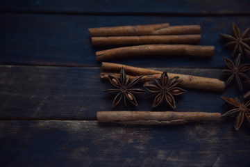 Cassia sticks and star anise on a brown background