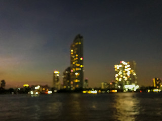Blur of modern city building at night with reflection