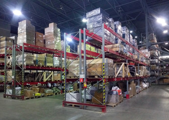 Shelving with goods in a logistics warehouse. Warehouse delivery and logistics.