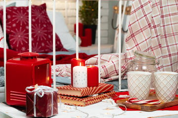 Interior decoration with red and white Christmas candles