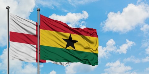 England and Ghana flag waving in the wind against white cloudy blue sky together. Diplomacy concept, international relations.