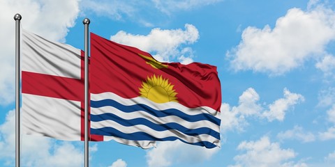 England and Kiribati flag waving in the wind against white cloudy blue sky together. Diplomacy concept, international relations.