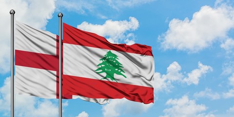 England and Lebanon flag waving in the wind against white cloudy blue sky together. Diplomacy concept, international relations.