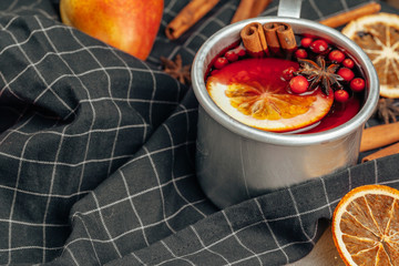 Christmas composition with  hot mulled wine in rustic cup