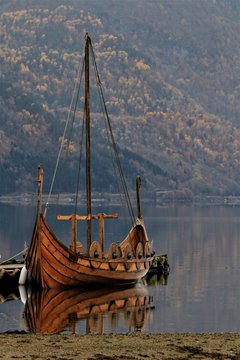 viking ship in beautiful Norwegian fjord landscape