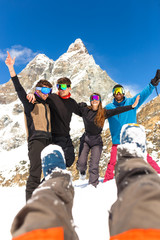 Happy People Group in Ski Equipment, Hugging Together, Looking at camera, Have Ski Resort Snow Winter Mountain.