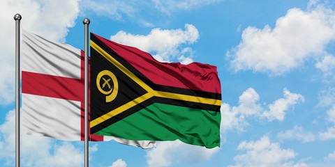 England and Vanuatu flag waving in the wind against white cloudy blue sky together. Diplomacy concept, international relations.