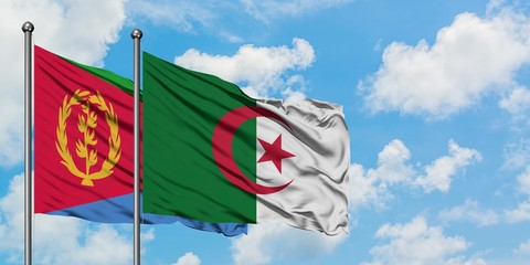 Eritrea and Algeria flag waving in the wind against white cloudy blue sky together. Diplomacy...
