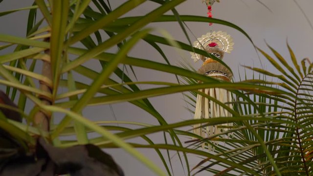 Steadicam shot of decorations made on an entrance to balinese house to celebrate Galungan holidays. The cultural life of Bali concept