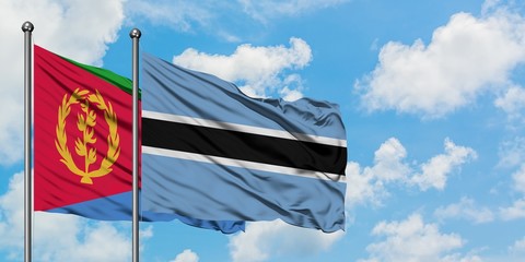 Eritrea and Botswana flag waving in the wind against white cloudy blue sky together. Diplomacy concept, international relations.