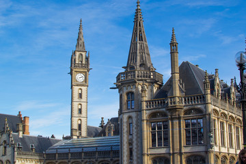 Back part of Former Post Office building with the clock tower at the background in Ghent, Belgium, Europe