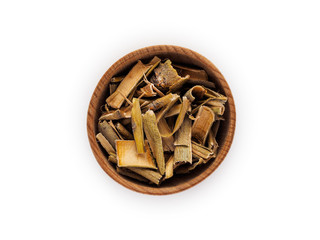 Willow bark in wooden Cup on white background