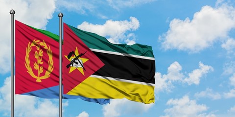Eritrea and Mozambique flag waving in the wind against white cloudy blue sky together. Diplomacy concept, international relations.