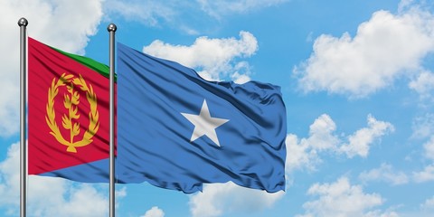 Eritrea and Somalia flag waving in the wind against white cloudy blue sky together. Diplomacy concept, international relations.