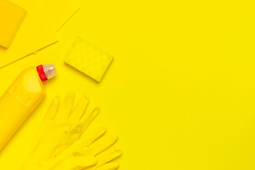 House cleaning concept. Household chemicals, disinfectant, bleach, antibacterial gel, yellow rubber...