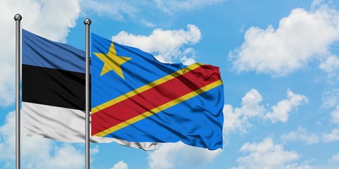 Estonia and Congo flag waving in the wind against white cloudy blue sky together. Diplomacy concept, international relations.