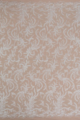 Texture lace fabric. lace on white background studio. thin fabric made of yarn or thread. a...